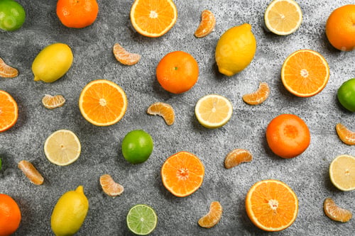 Preview: Flat lay composition with tangerines and different citrus fruits on grey background