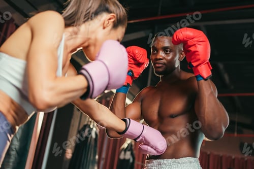 Preview: Asian woman training kick boxing with punching glove, fitness woman with physical exercising trainer