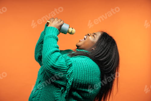Preview: Image of a beautiful woman posing in casual clothes on a colored background.