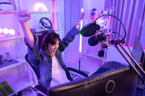 Preview: Male Gamer Raised His Fist Celebrate the Victory of the Game at Home