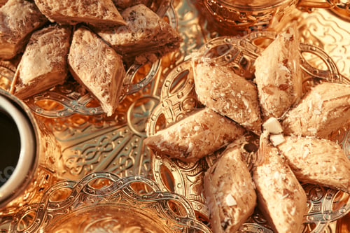 Preview: Turkish sweets with coffee on a wooden table. Creative photo