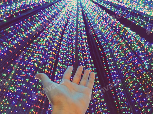 Preview: Hand over bokeh light at night