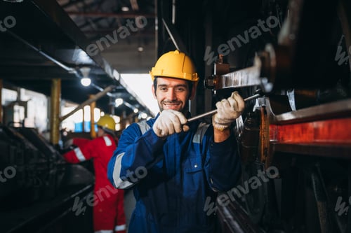 Preview: Industrial engineers inspect and perform maintenance on the machines at factory machines.