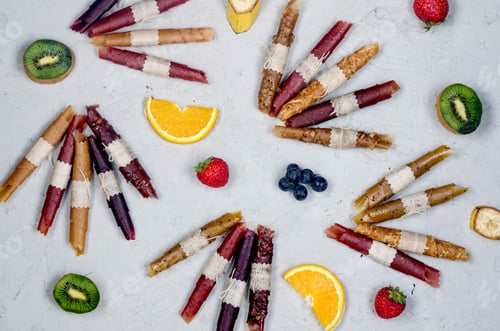 Preview: assortied ripe fruits and dried chips scattered on grey background.