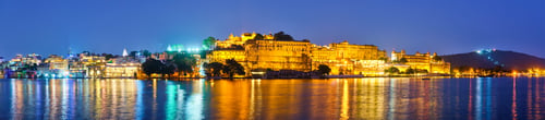 Preview: Udaipur City Palace in the evening panorama. Udaipur, India