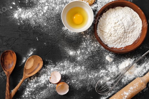 Preview: Preparation for baking. Eggs and flour on black background