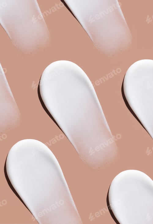 Preview: pattern cosmetic smears cream texture on pastel brown background