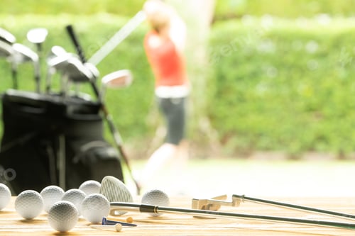 Golf Balls and Clubs near Golf Course