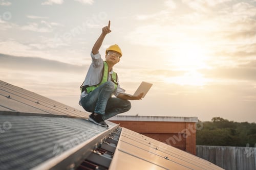 Preview: Service engineer checking solar cell on the roof for maintenance if there is a damaged part.