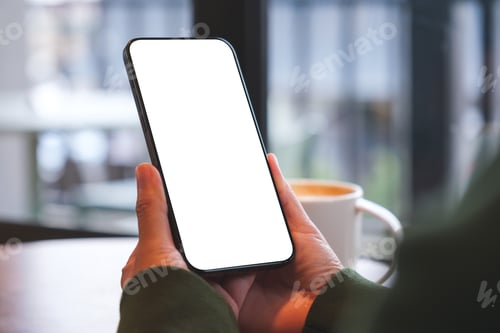 Preview: Mockup image of a woman holding mobile phone with blank desktop screen in cafe