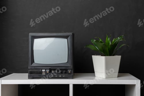 Preview: old fashioned vintage tv television on the shelf at home