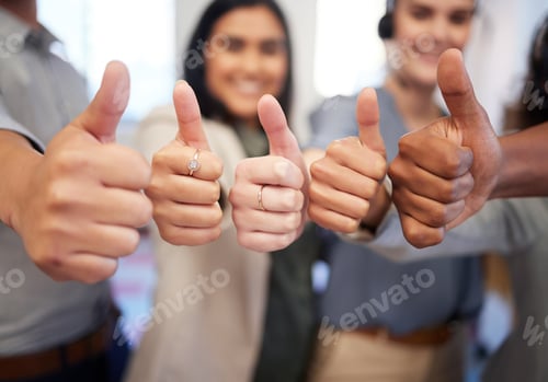 Preview: Closeup shot of a group of unrecognisable businesspeople showing thumbs up in an office