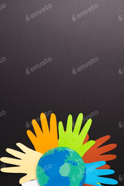 Preview: Paper cut out of multi coloured hands and globe with copy space on black background