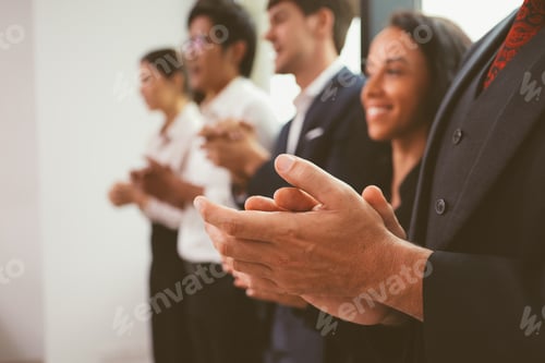 Preview: Happy business employees team celebrating success with praise in meeting room