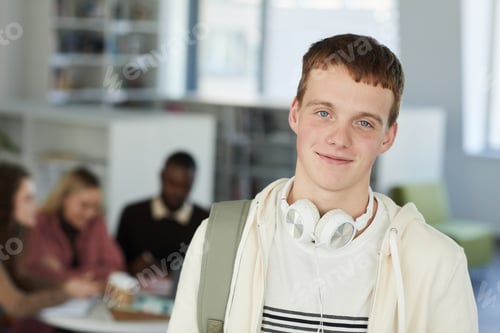 Preview: Portrait of Smiling Young Man in Library