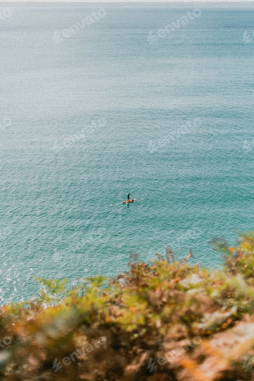 Preview: A man on a stand up paddle in the big blue sea