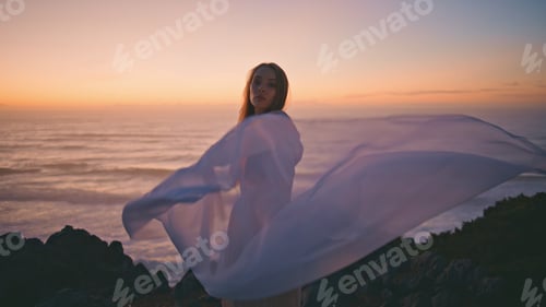 Preview: Sensual girl waving cloth performing contemporary dance in summer sunset hill