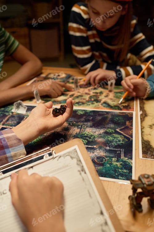 Preview: Hand of girl holding several dice
