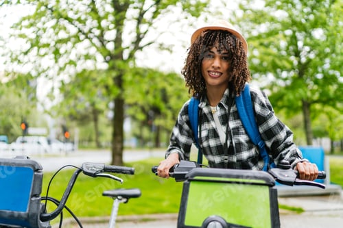 Preview: Young latin american student renting a bike in the city