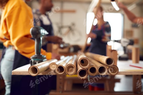 Preview: Close Up Of Team In Workshop Assembling Hand Built Sustainable Bamboo Bicycle Frame