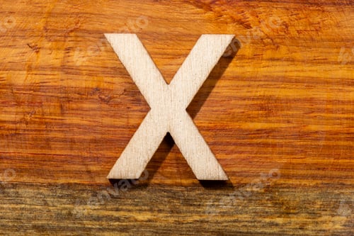 Preview: Wooden letters X on wooden background, top view