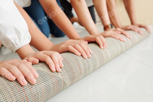 Preview: Family unfolding big carpet