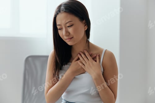 Preview: Heart attack. Suffering from pain tanned beautiful young Asian woman hold hand on chest heart crying