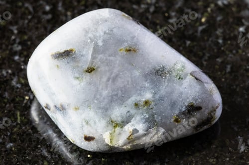 Preview: sample of polished melilite mineral on black