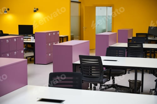Preview: Call center with yellow walls and tables standing in lines