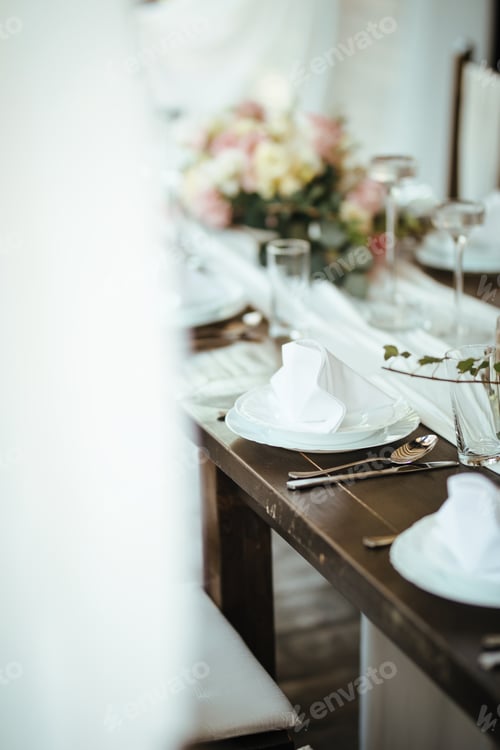 Preview: Dining table at wedding reception.