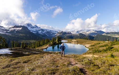 Preview: Hiker Exploring Elfin Lakes with Snowcapped Mountains in Squamish, BC