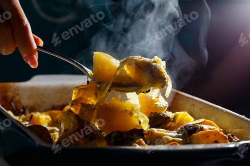 Preview: Girl picks up a spoonful of baked potatoes with mushrooms and cheese