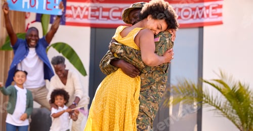 Preview: Multi-Generation Family Welcoming Army Father Home On Leave With Banner