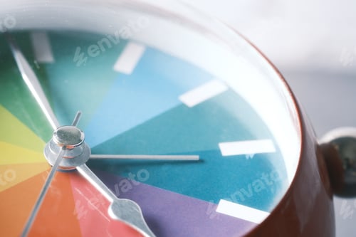 Preview: detail shot of colorful old alarm clock on color background.