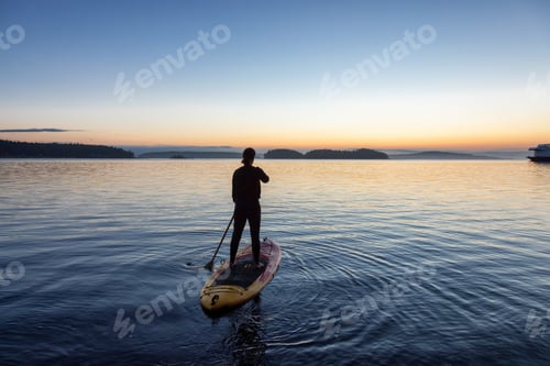 Preview: Adventurous Caucasian Adult Woman on a Stand Up Paddle Board