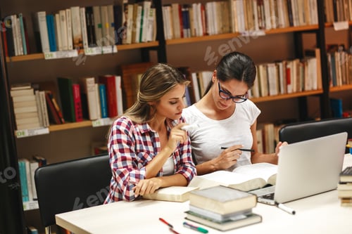 Preview: Group of female students study in the college library.