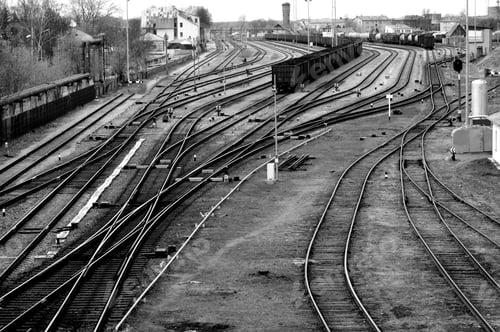 Preview: Grayscale aerial view of a train station in the station with multibars of a railway station