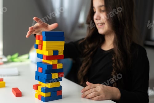 Preview: Cute little girl excites with wooden block game