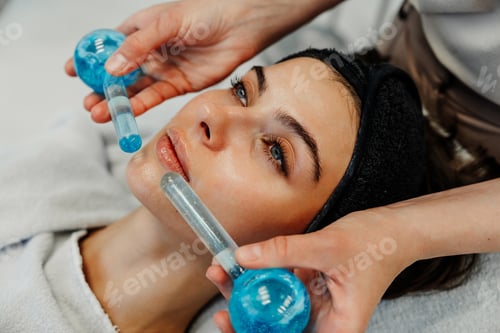 Preview: The master gives the client a relaxing facial massage using cold cryo spheres.