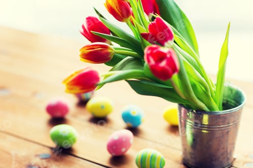 Preview: close up of easter eggs and flowers in bucket
