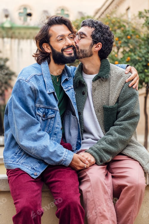 Preview: young man kissing tenderly his boyfriend cheek