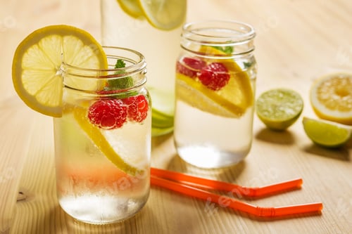 Preview: soda with lemon and berries on wooden table