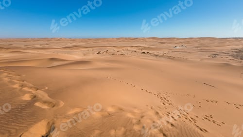 Preview: Serene desert landscape with sand dunes and clear blue sky in Namibia, Africa