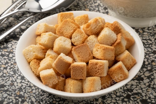 Preview: White bowl with croutons for seasoning close up