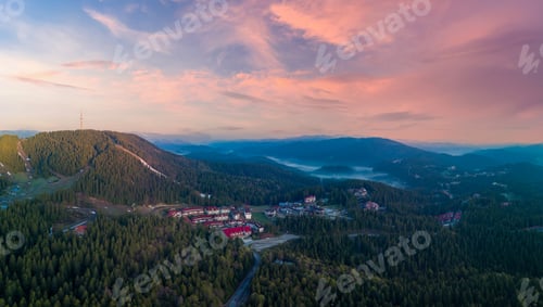 Preview: Resort complex of hotels in valley of Rhodope Mountains under cloudy sunny sky. Panorama, top view