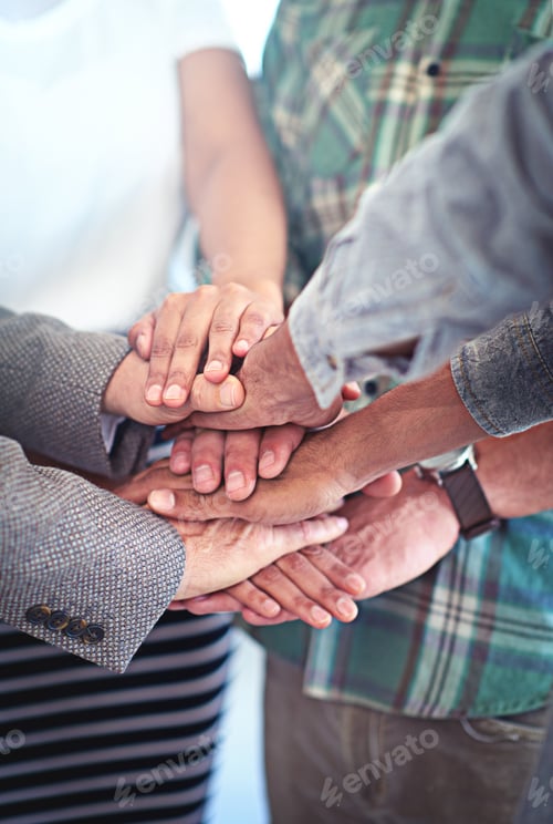 Preview: This team has each others backs. Closeup shot of a group of coworkers with their hands in a huddle.