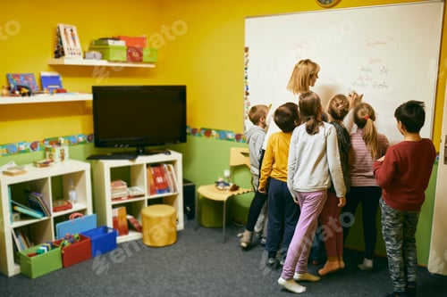 Preview: Teacher with students writing on whiteboard
