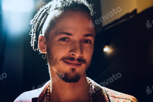 Preview: Close-up portrait of a young stylish man with dreadlocks