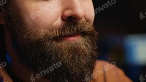 Preview: Upbeat IT specialist pleased after solving script errors, extreme close up