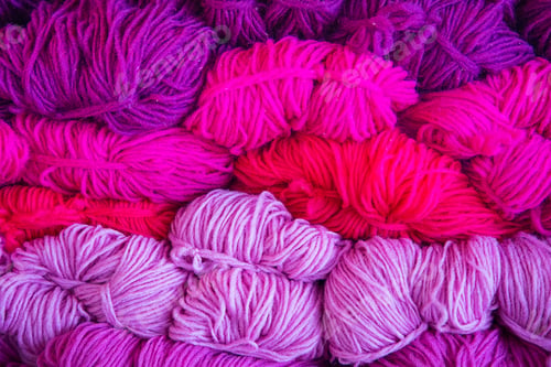 Colorful Yarn Bundles in Shades of Pink and Purple